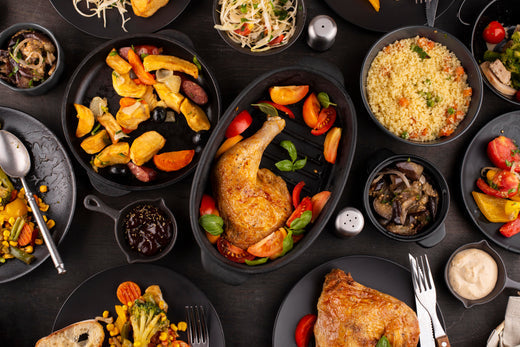 A variety of dishes featuring roasted chicken and colorful vegetables demonstrating food flavor pairing techniques.